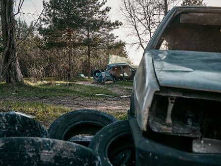 Abandoned and destroyed cars, post-apocalyptic look. sunny day