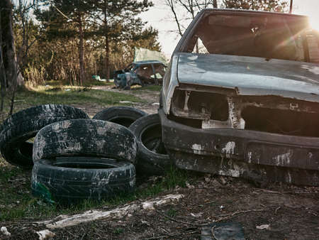 Abandoned and destroyed cars, post-apocalyptic look. sunny dayの写真素材