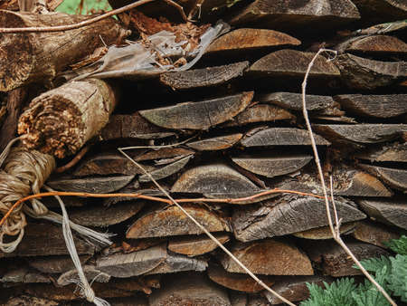 A stack of old boards lying outdoors near the barn. textureの写真素材