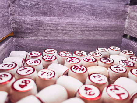 Wooden lotto barrels in a wooden box. Family game,の写真素材