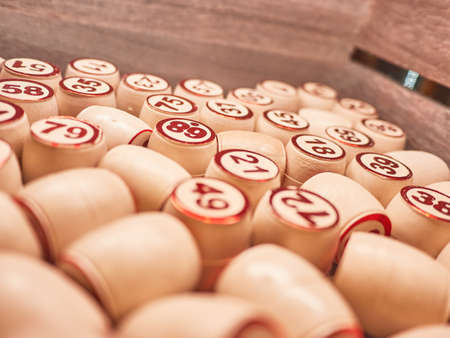 Wooden lotto barrels in a wooden box. Family game,の写真素材