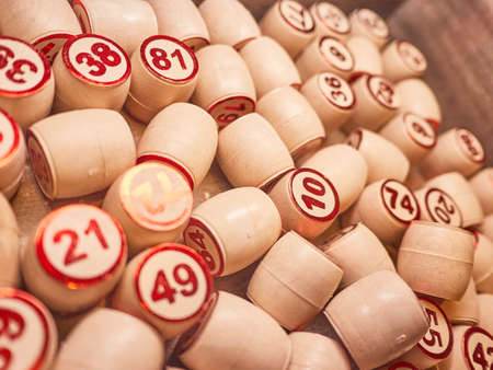 Wooden lotto barrels in a wooden box. Family game,の写真素材