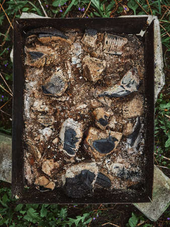 Brazier after barbecue. Burning out coals and ash at the bottom of the barbecue.の写真素材