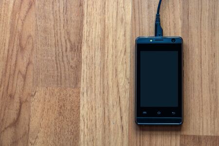 Charging a low battery smartphoneの写真素材