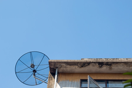 Satellite dish on background blue skyの写真素材