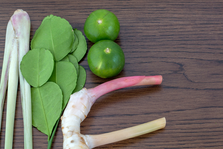 Herb ingredient of Tom Yum spicy soup Traditional Thai food cuisine on wood backgroundの写真素材