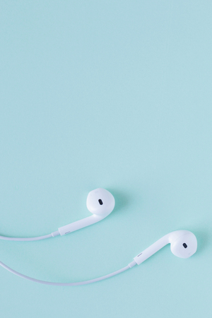 white headphone on blue pastel backgroundの写真素材
