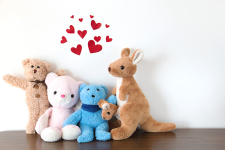 Cute  teddy bear , mom and baby kangaroo with red balloons isolated white background that they are happy and smiling ,Happy conceptの写真素材