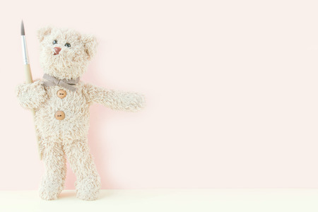 Teddy bear holding paintbrush ,Teddy would like to paintの写真素材