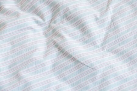 Texture of fabric is white color background,Creased white cloth material fragment as a background