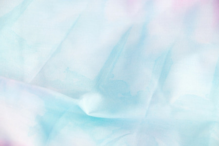 Texture of fabric is blue and pink color background,Wavy folds of cloth.の写真素材
