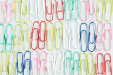 Paper clips colorful object on blue color background