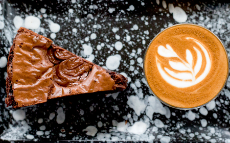 Hot coffee drink ,Latte art with tasty brownieの写真素材