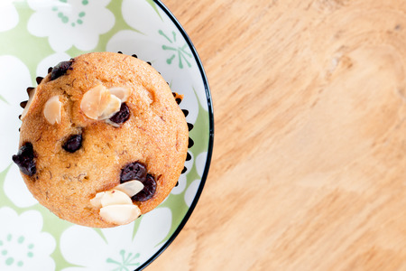 Yummy banana cupcake with whole grain on wood backgroundの写真素材