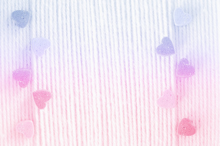 Mini sweethearts on yarn is pastel color background.の写真素材