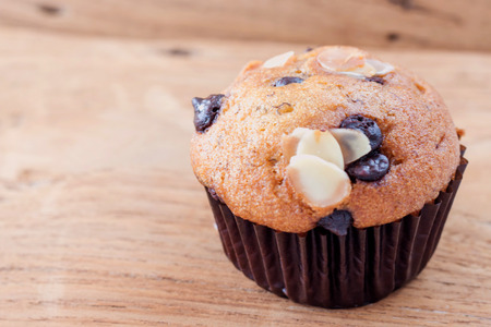Yummy banana cupcake with whole grain on wood backgroundの写真素材