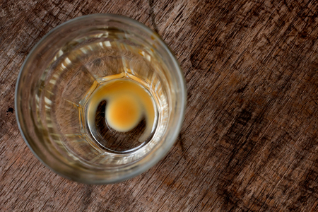 Empty coffee cup after drink with wood backgroundの写真素材
