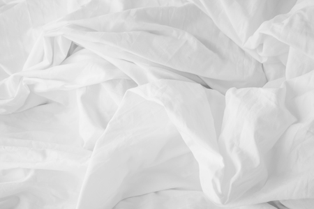 Texture of fabric is white color background,Wavy folds of cloth.の写真素材