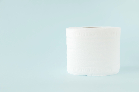 Tissues paper roll on blue color background.の写真素材