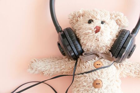 Cute teddy bears in headphones listening to music , A happy and relax mode. の写真素材