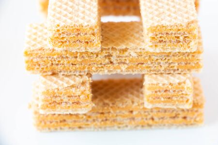 Delicious wafers stick on pastel background