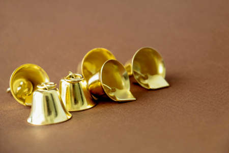 Golden bells on a brown background, Celebration conceptの写真素材