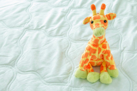 giraffes cute are seating on green fabric, Baby giraffesの写真素材