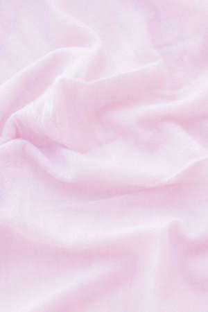 Creased pink cloth material as a backgroundの写真素材