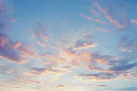 Sunset sky with pink and blue clouds. Beautiful nature background.