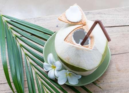 Fresh coconut on wooden tableの写真素材