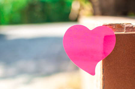 Blank note pad or sticky notes pink with outdoor sunlight background,Happy valentine day.の写真素材