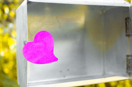 Blank note pad or sticky notes pink on post box with sunlight background,Happy valentine day.の写真素材