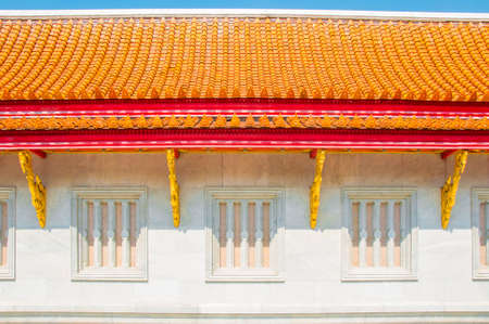 The Marble wall and roof at Wat Benchamabophit Dusitvanaram with blue sky background , Bangkok THAILANDの写真素材