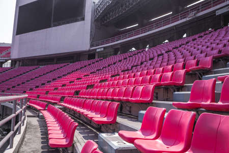 red Rows of empty seat in football stadiumのeditorial素材