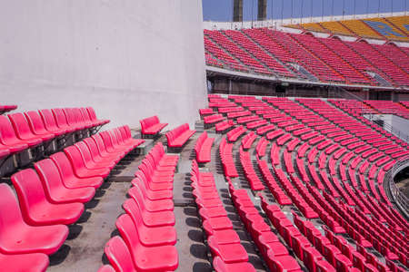 Outdoor Empty white billboard screen for advertising in stadium with seats rows and blue sky backgroundのeditorial素材