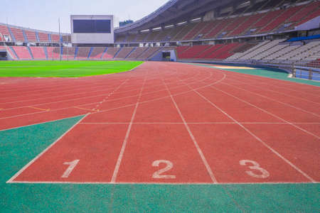 red running track field with number in the stadium backgroundのeditorial素材