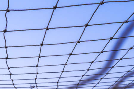 Football Net with blue sky backgroundの写真素材