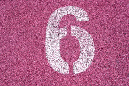 Number six sixth 6 on the start of a running track - check my portfolio for other numbersの写真素材