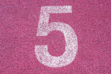 Number five fifth 5 on the start of a running track - check my portfolio for other numbersの写真素材