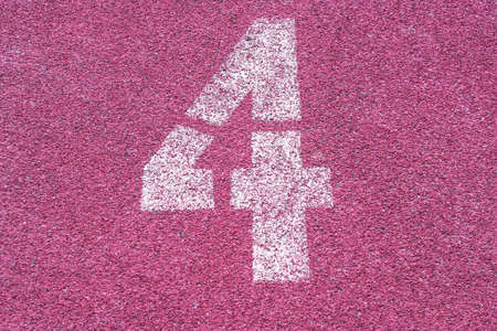 Number four fourth 4 on the start of a running track - check my portfolio for other numbersの写真素材