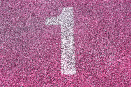 Number one first 1 on the start of a running track - check my portfolio for other numbersの写真素材