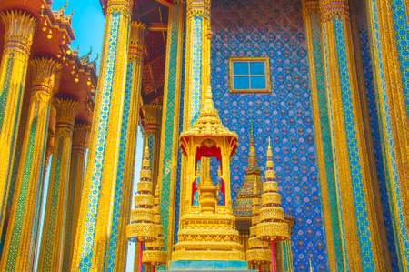 The Golden Crown and Throne with Temple and Blue Sky Background at Wat Phra Kaew, Grand Palace, Bangkok, Thailand.のeditorial素材