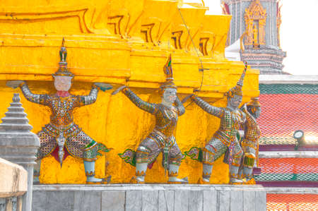 Giants under golden pagoda, Warrior statue at The Grand Palace and the temple Wat Phra Kaeo. Bangkok. Thailand, They are public domain or treasure of Buddhism.のeditorial素材