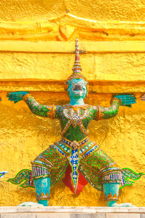 Giants under golden pagoda, Warrior statue at The Grand Palace and the temple Wat Phra Kaeo. Bangkok. Thailand, They are public domain or treasure of Buddhism.のeditorial素材