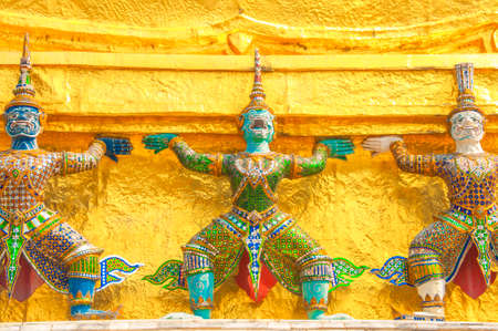 Giants under golden pagoda, Warrior statue at The Grand Palace and the temple Wat Phra Kaeo. Bangkok. Thailand, They are public domain or treasure of Buddhism.のeditorial素材