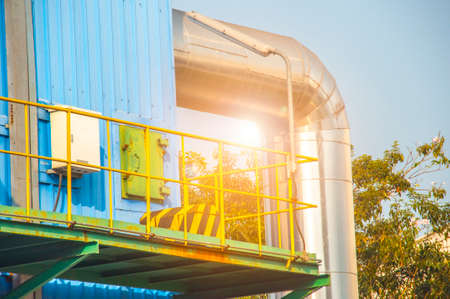 Close up Industrial view at oil refinery plant form industry zone with blue sky and sunrise sky backgroundの写真素材