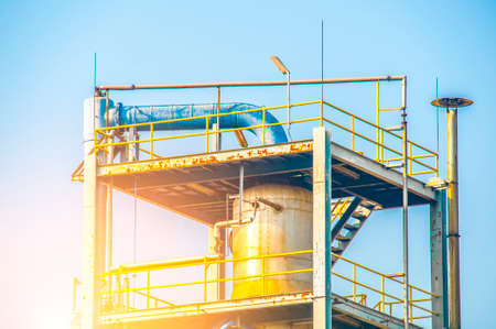 Close up Industrial view at oil refinery plant form industry zone with blue sky and sunrise sky backgroundの写真素材