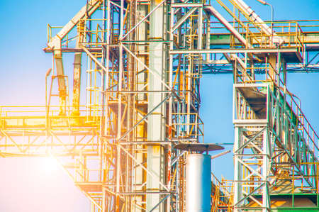Close up Industrial view at oil refinery plant form industry zone with blue sky and sunrise sky backgroundの写真素材