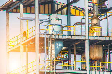 Close up Industrial view  of pipelines and valves at oil refinery plant form industry zone with sunrise sky backgroundの写真素材