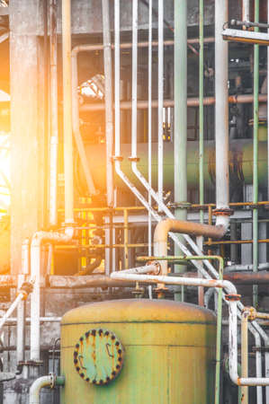Close up Industrial view of pipelines and valves  at oil refinery plant form industry zone with sunrise sky backgroundの写真素材